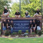 Students at Carl Albert State College Campus Sign